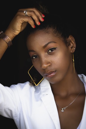 Shallow Focus Photo of Woman in White Long-sleeved Top