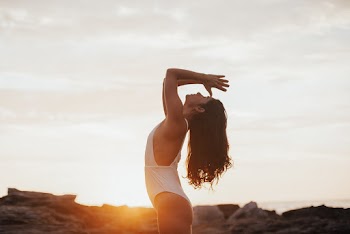 Shallow Focus Photo of Woman in White Sleeveless Shirt