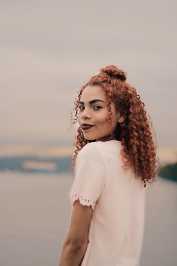 Shallow Focus Photo of Woman in White T-shirt