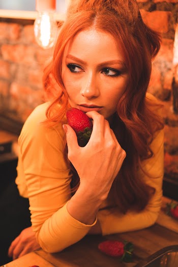 Shallow Focus Photo of Woman in Yellow Long-sleeved Shirt