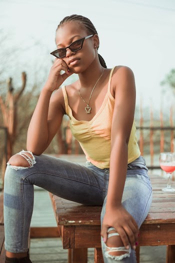 Shallow Focus Photo of Woman in Yellow Spaghetti Strap Top