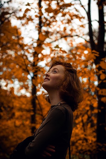 Shallow Focus Photo of Woman Looking Up