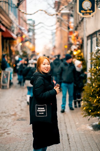 Shallow Focus Photo of Woman Standing on Street