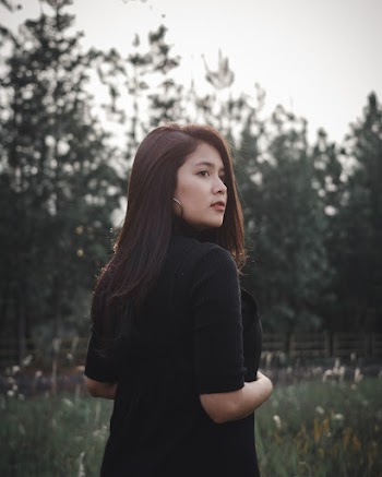 Shallow Focus Photo of Woman Wearing Black Top