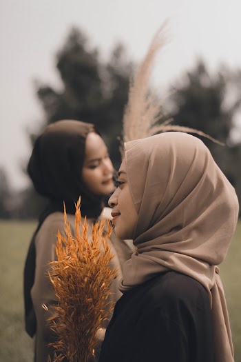 Shallow Focus Photo of Woman Wearing Brown Hijab