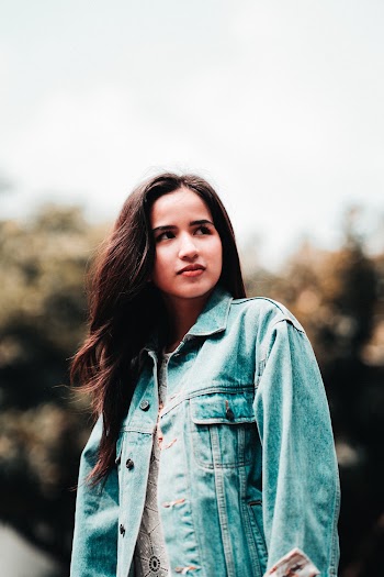 Shallow Focus Photo of Woman Wearing Denim Jacket