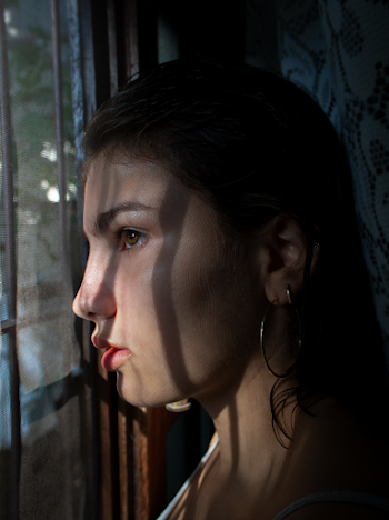 Shallow Focus Photo Of Woman Wearing Hoop Earring