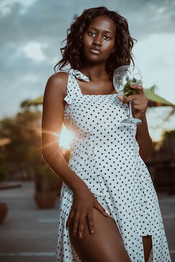 Shallow Focus Photo of Woman Wearing Polka Dot Dress