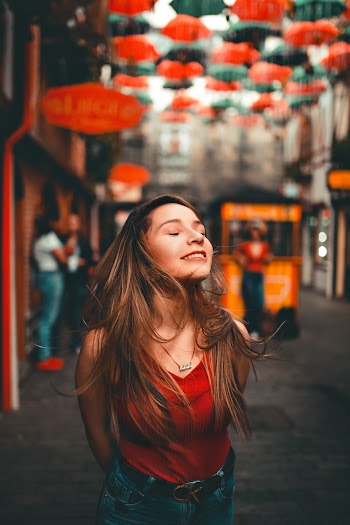 Shallow Focus Photo of Woman Wearing Red Top