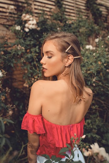 Shallow Focus Photo of Woman Wearing Red Tube Top