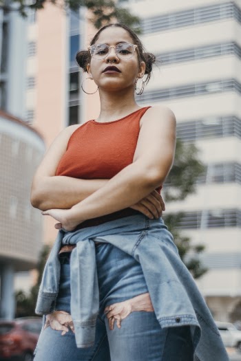 Shallow Focus Photo of Woman Wearing Tank Top