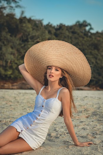 Shallow Focus Photo of Woman Wearing White Thick Strap Dress