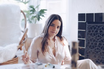 Shallow Focus Photo of Woman Wearing White V-neck Long-sleeved Shirt