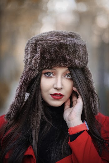 Shallow Focus Photo of Woman Wearing Winter Fur Hat