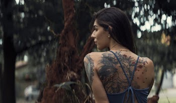 Shallow Focus Photo of Woman With Tattoos