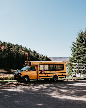 Shallow Focus Photo of Yellow Bus