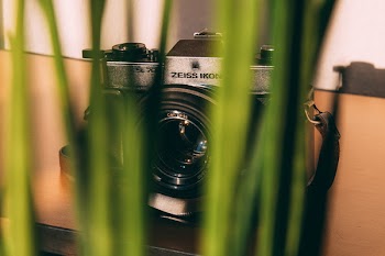 Shallow Focus Photography of Black and Gray Dslr Camera