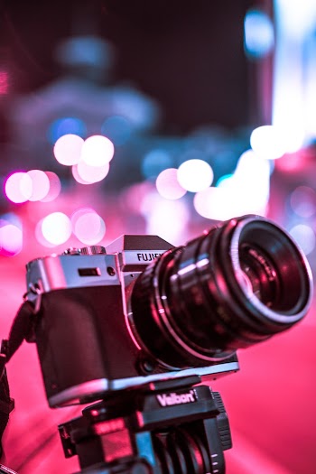 Shallow Focus Photography Of Black And Silver Fujifilm Camera