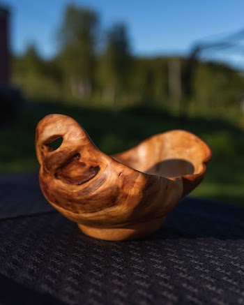 Shallow Focus Photography of Brown Wooden Bowl on a Black Surface