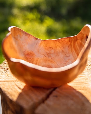 Shallow Focus Photography of Brown Wooden Bowl on a Round Wooden Surface