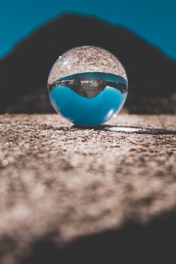 Shallow Focus Photography of Clear Glass Ball