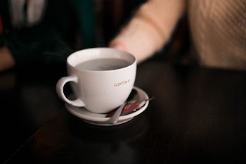 shallow focus photography of coffee cup