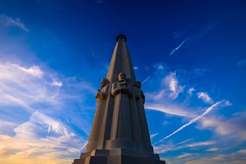 Shallow Focus Photography of Concrete Statues