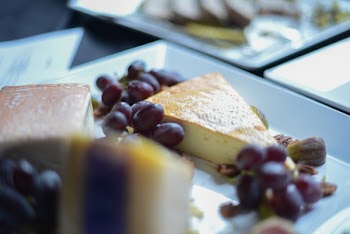Shallow Focus Photography of Grapes and Sliced Cake