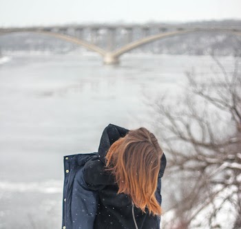 Shallow Focus Photography of Person in Black and Blue Hoodie