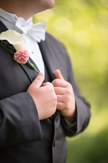 Shallow Focus Photography Of Person Wearing Formal Coat