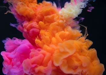 shallow focus photography of pink and orange smoke