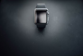 shallow focus photography of silver Apple Watch with black Sport Band