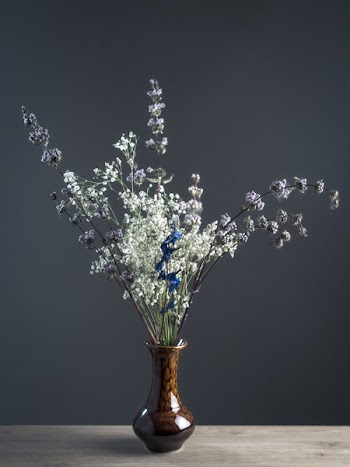 Shallow Focus Photography of White and Gray Flowers in Brown Ceramic Vase