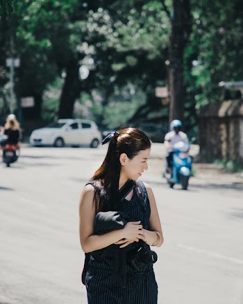Shallow Focus Photography of Woman in Black Sleeveless Top