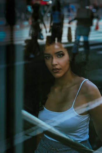 Shallow Focus Photography of Woman In White Spaghetti Strap Top
