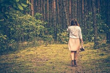 Shallow Focus Photography of Woman Surrounded by Trees