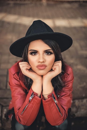 Shallow Focus Photography of Woman Wearing Red Leather Jacket