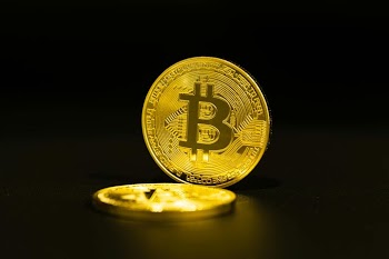 Shiny Bitcoin Coins on Black Background