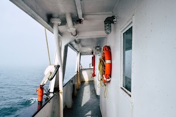 ship travelling surrounded by fogs