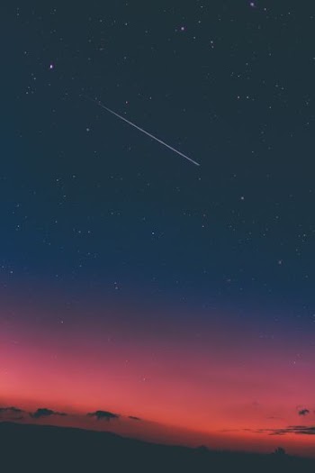 shooting star in night sky