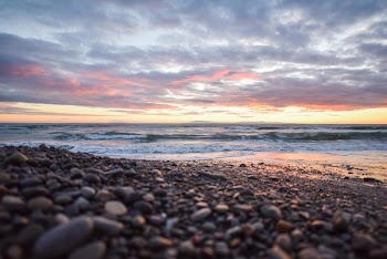 Shoreline Under Nimbus Clouds