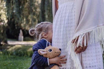 Shy little girl with her mom
