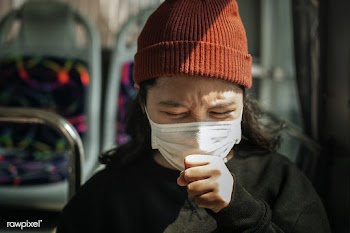 Sick woman in a mask coughing in public during coronavirus pandemic | Free  photo - 2296489