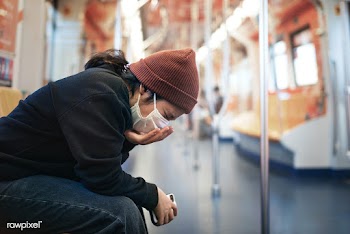 Sick woman in a mask coughing in public during coronavirus pandemic | Free  photo - 2300717