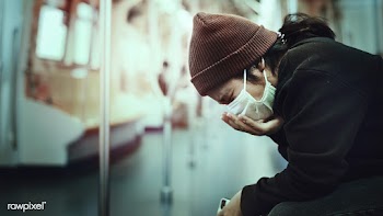 Sick woman in a mask coughing in public during coronavirus pandemic | Free  photo - 2300994