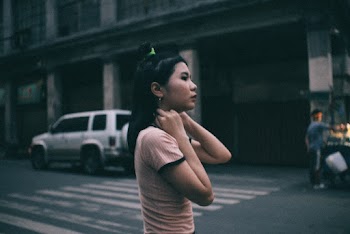 Side View Of A Girl Crossing The Street