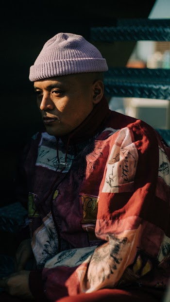 Side View Of A Man in Red and White Jacket