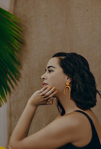 Side View Of A Woman in Black Tank Top