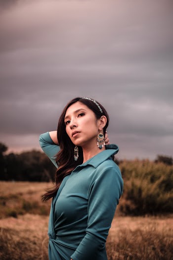 Side View Photo o Woman in Blue Collared Outfit Posing