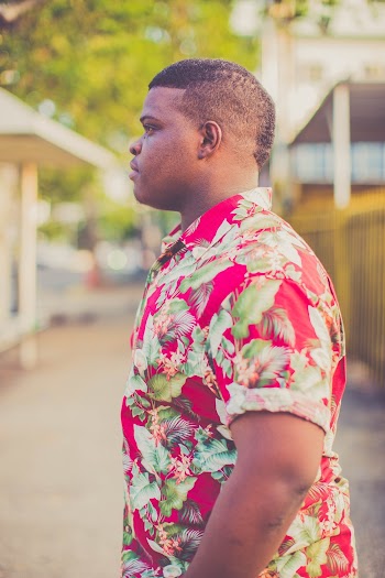 Side-view Photo of Man Wearing Pink, White, and Green Floral Dress Shirt